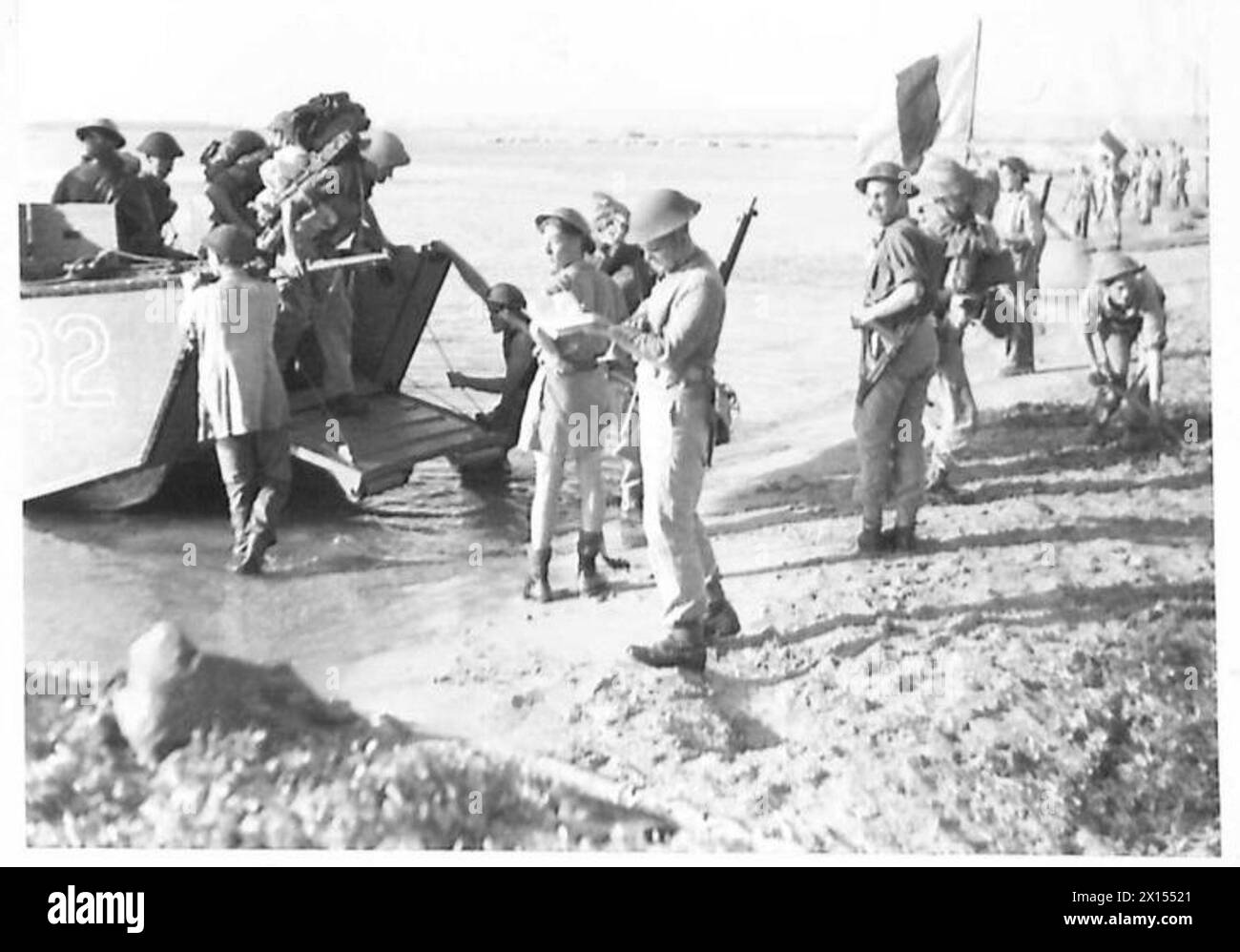 INVASION OF SICILY - Landing craft putting the sotres and personnel ashore British Army Stock Photo