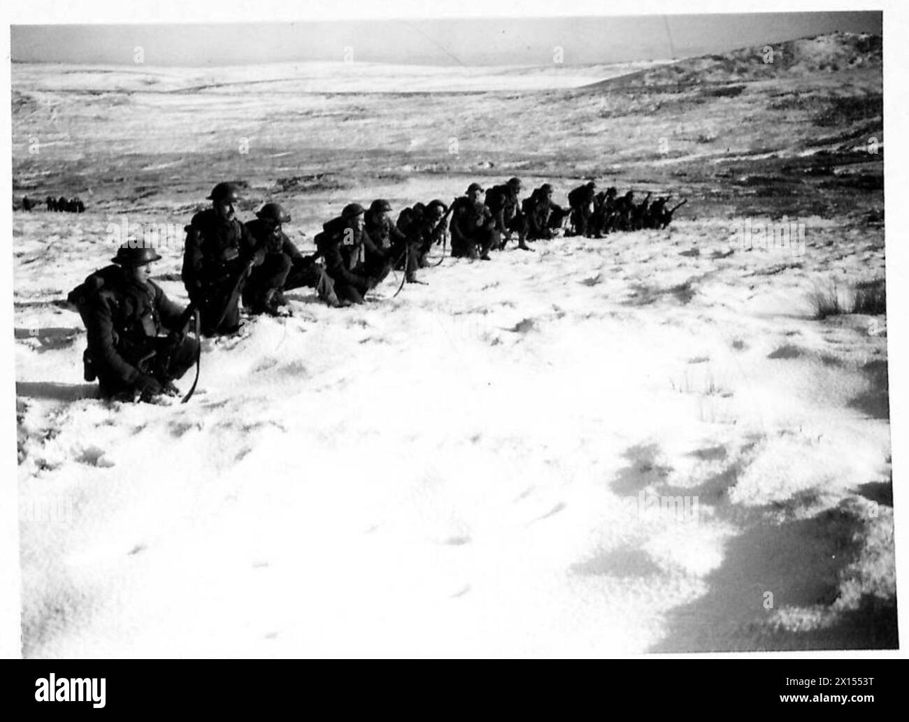 BRITAIN'S ARMY TRAINS UNDER ACTUAL SHELL FIRE - Troops in position ...