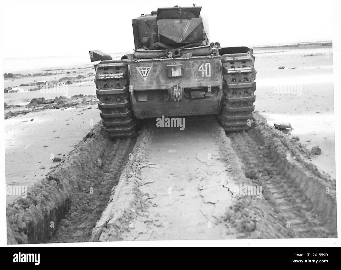 SPECIAL ASSIGNMENT FOR 79TH ARMOURED DIVISION - Tracks made in sand during run British Army Stock Photo