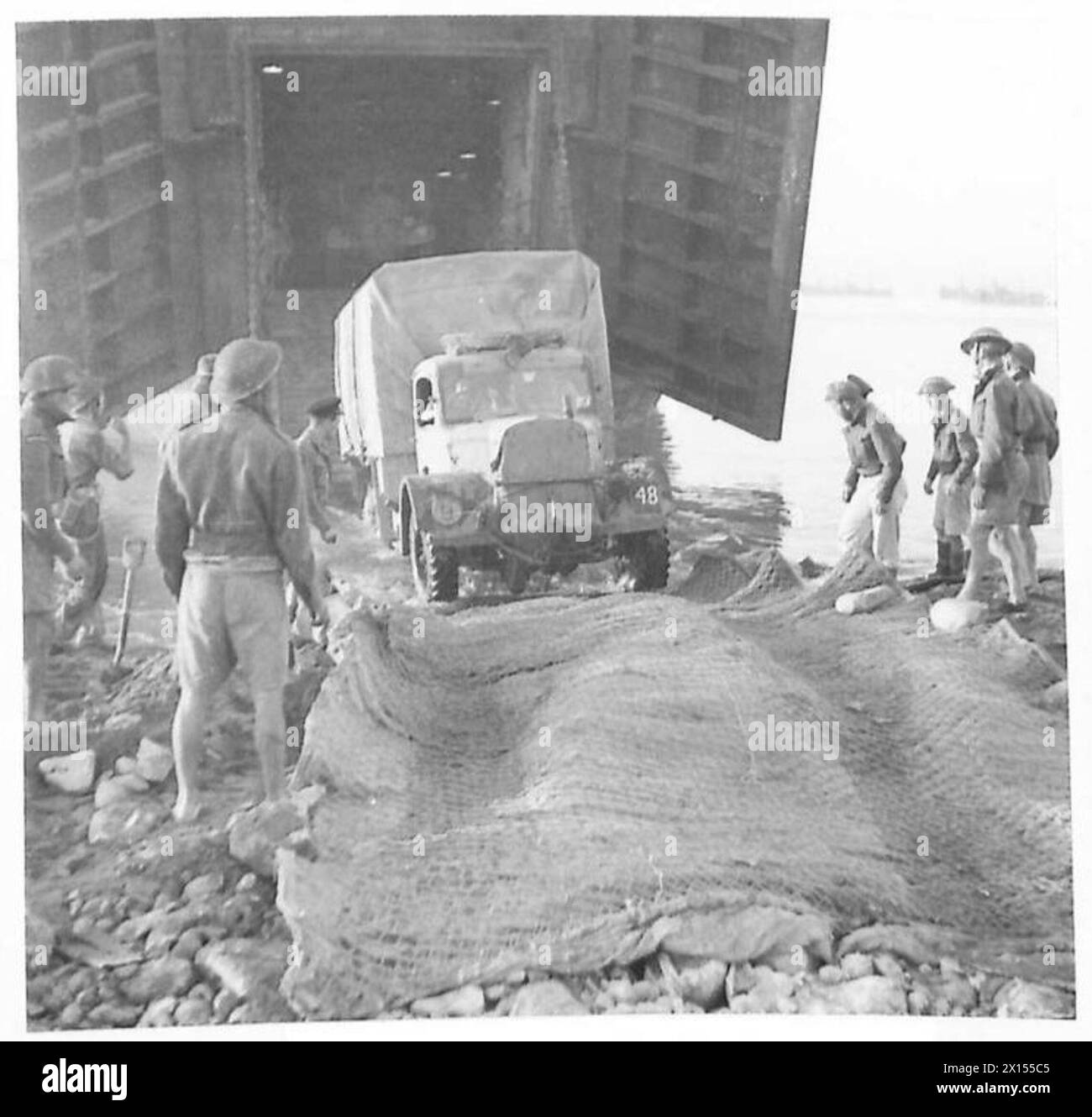 INVASION OF SICILY - Unloading transport from a Landing Craft British Army Stock Photo
