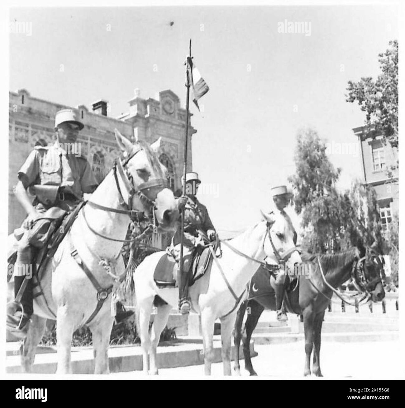 THE FALL OF DAMASCUS - The standard bearer with the French flag of the Free French Circassion Cavalry who escorted the Generals through the town British Army Stock Photo