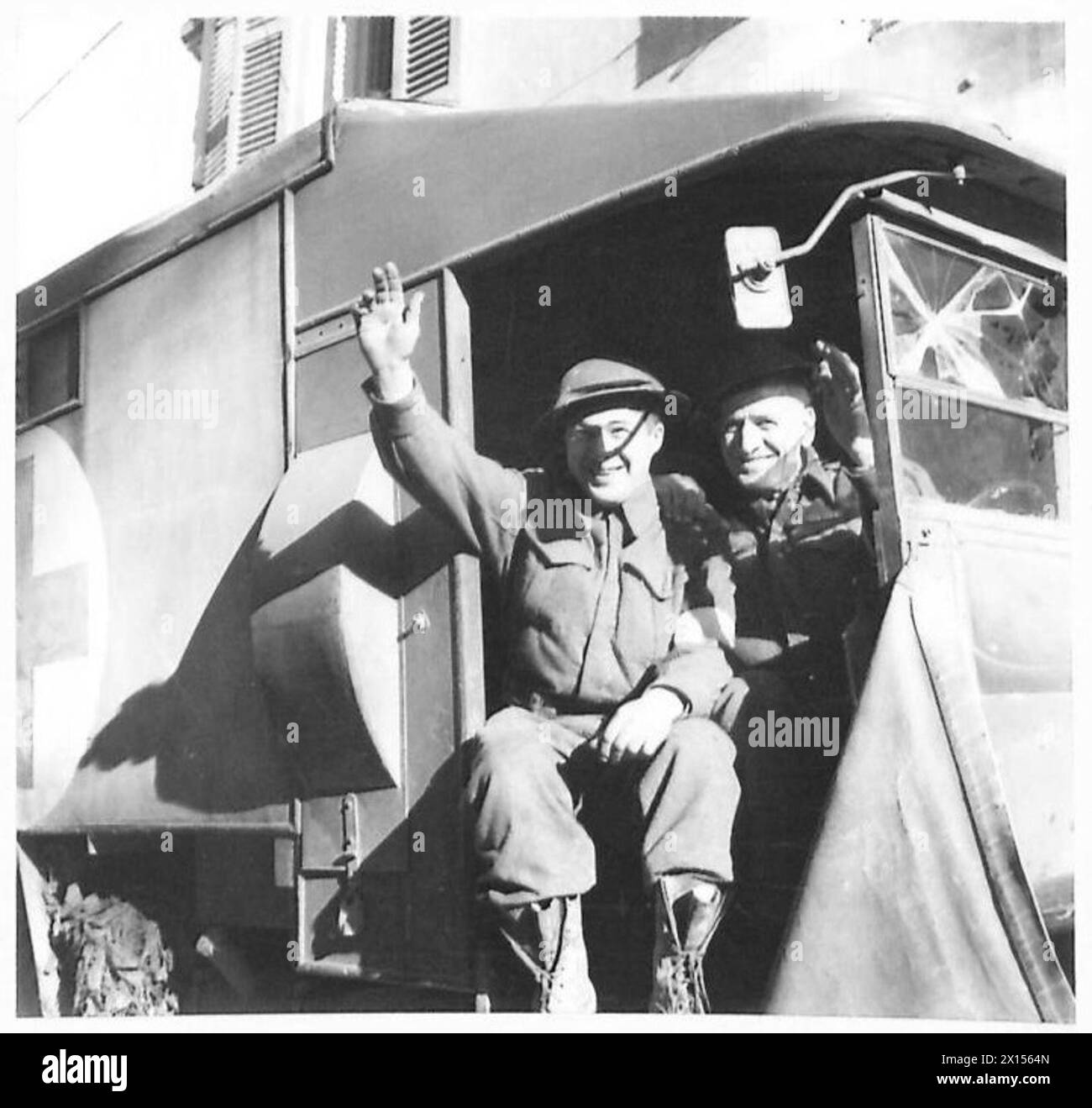 THE BRITISH ARMY IN NORTH AFRICA, SICILY, ITALY, THE BALKANS AND AUSTRIA 1942-1946 - Pte. Clarence Robichaud of St. Paul, New Brunswick, and Cpl. Tom Oddie of Hamilton, who drive an ambulance at the front, are great pals. Pte. Robichaud who is now 19 years of age enlisted when he was 16, and Cpl. Oddie, who will not divulge his age, is thought to be the oldest serving member in the Division British Army Stock Photo