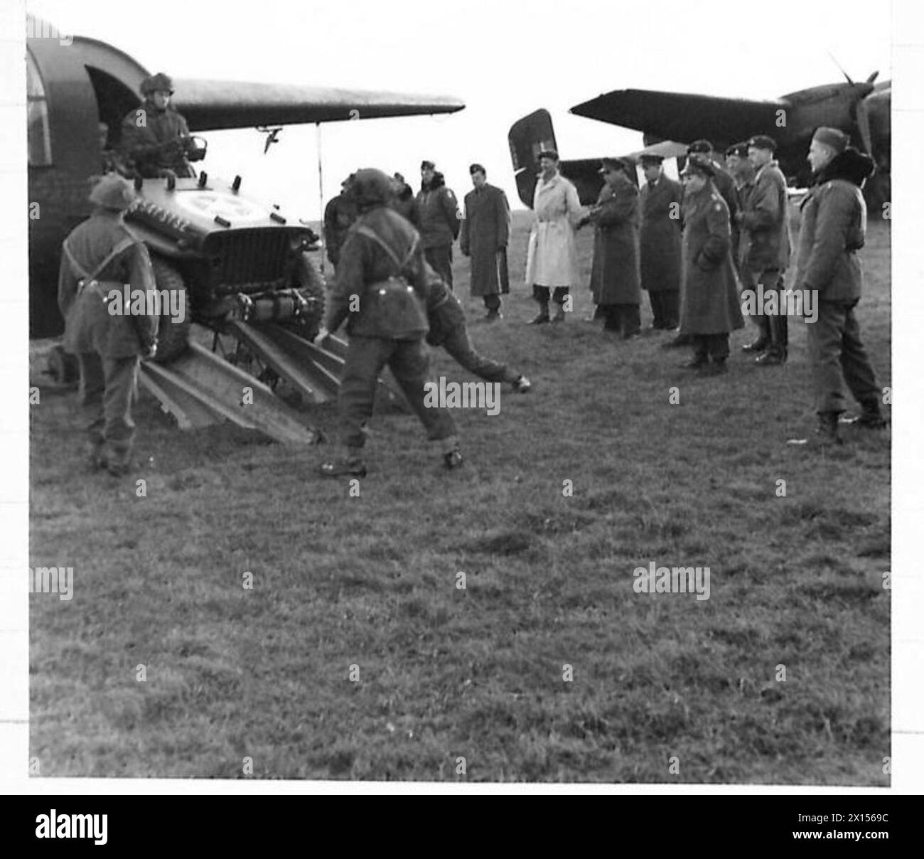 GENERAL BRERETON INSPECTS 6TH AIRBORNE DIVISION [BR] EQUIPMENT - Lieutenant General Brereton, watches a jeep coming out of the new Horsa glider, in which the nose swings clear to allow vehicles a straight run out when the aircraft goes on operations British Army Stock Photo