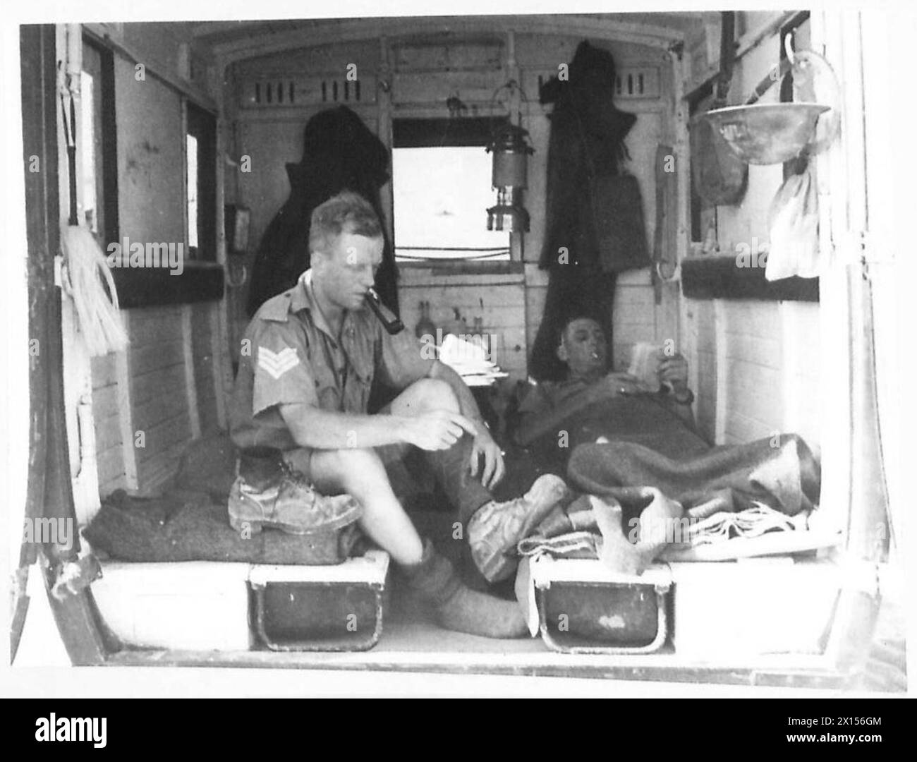PHOTOGRAPHS TAKEN OF THE WORK OF THE MILITARY POLICE IN THE WESTERN DESERT - The interior of the Italian ambulance where these few M.Ps live British Army Stock Photo