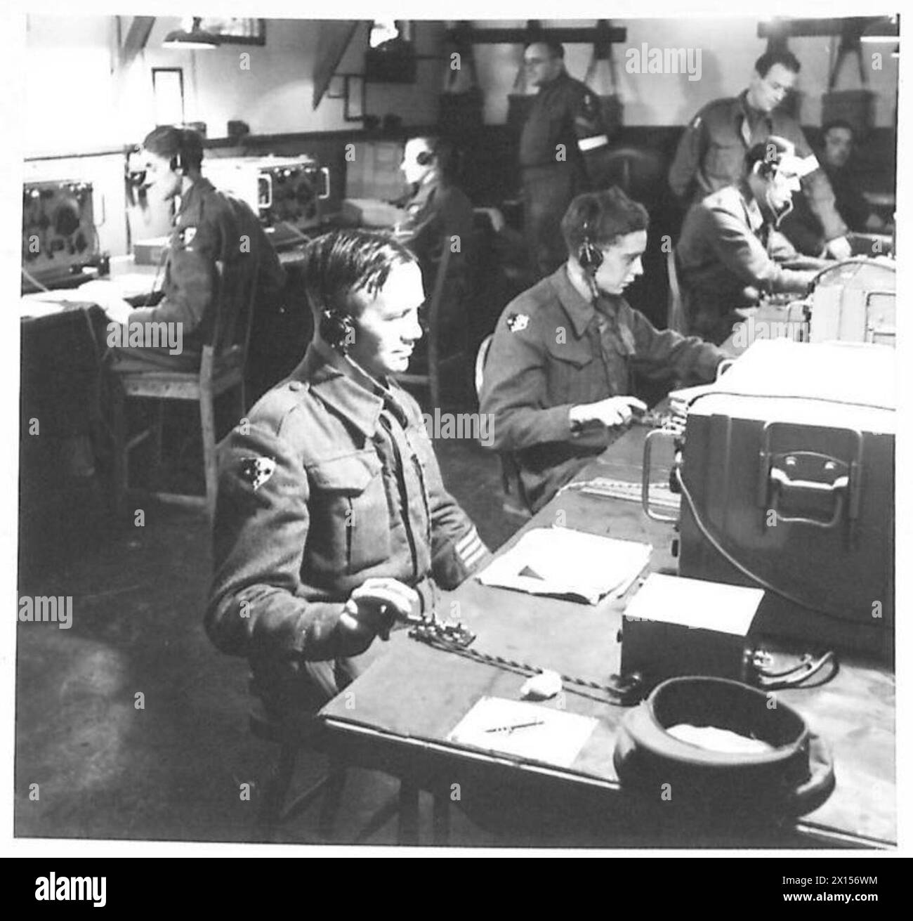 Royal Corps of Signals operators work at receiving sets in a wireless ...