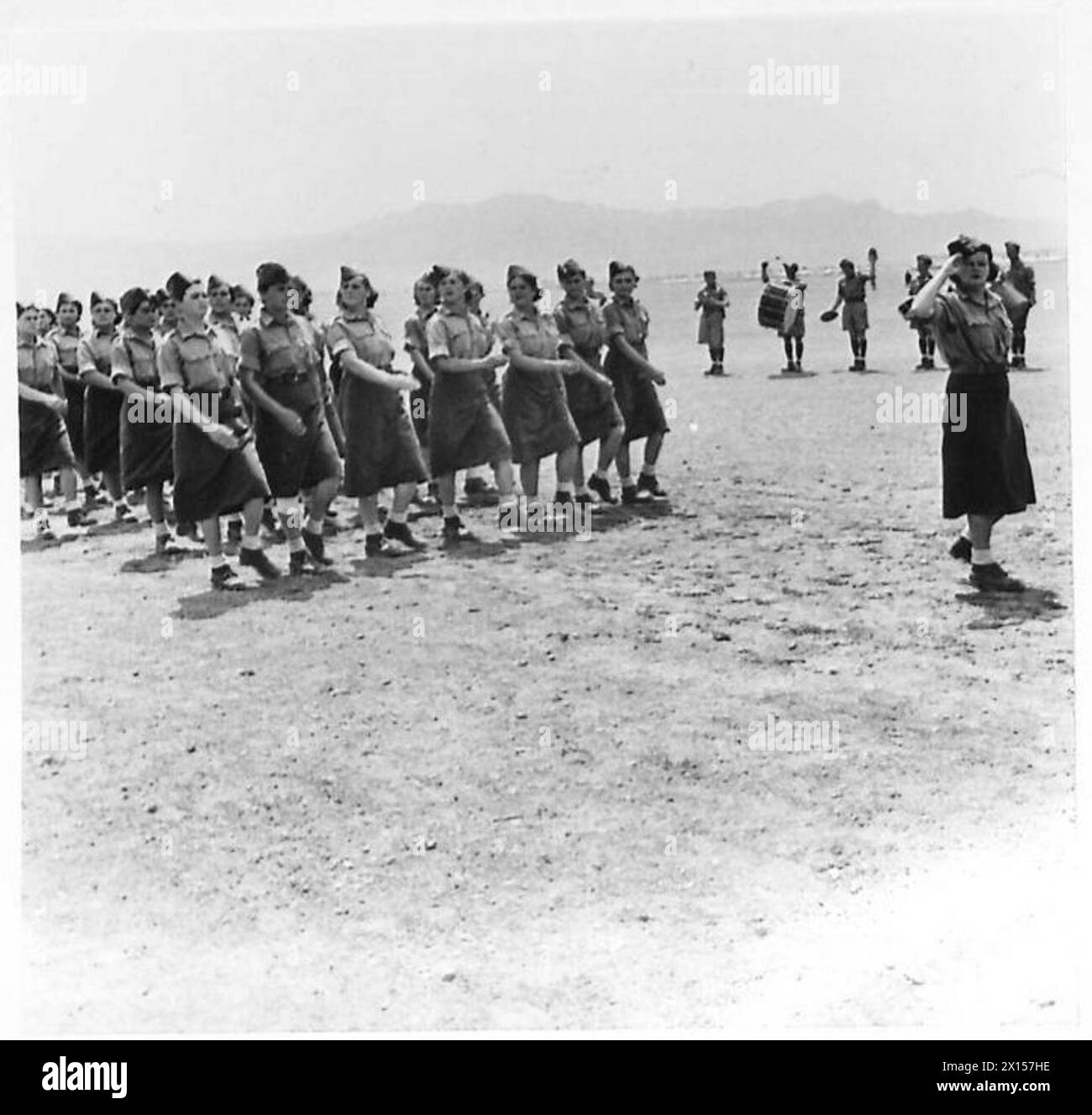 A Women's Auxiliary Service unit of the Polish Army marches past Prince ...