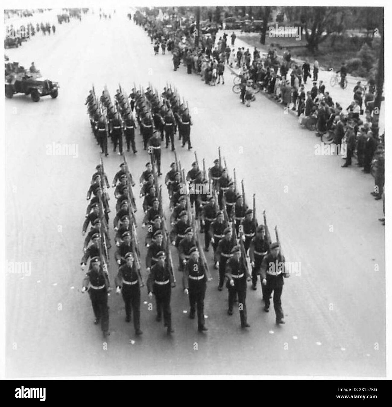 BRITISH VICTORY PARADE IN BERLIN - Scenes in the Charlottenburger Chausse during the march past British Army, 21st Army Group Stock Photo
