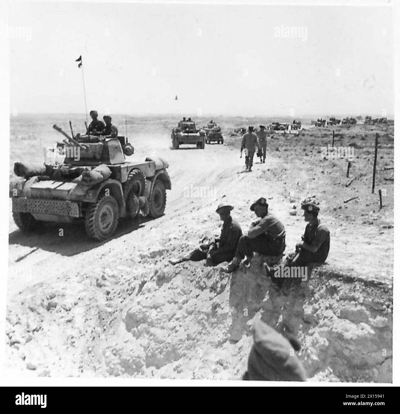 BATTLE OF THE GABES GAP - Armoured cars moving through a mine gap which ...