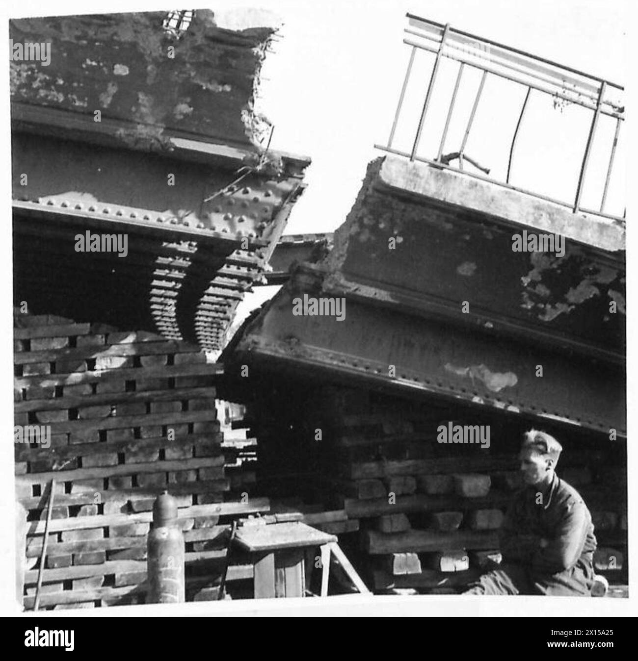 BRIDGE REBUILDING IN CAEN - The lower end of bridge has risen as jacks are reversed after removing packing British Army, 21st Army Group Stock Photo