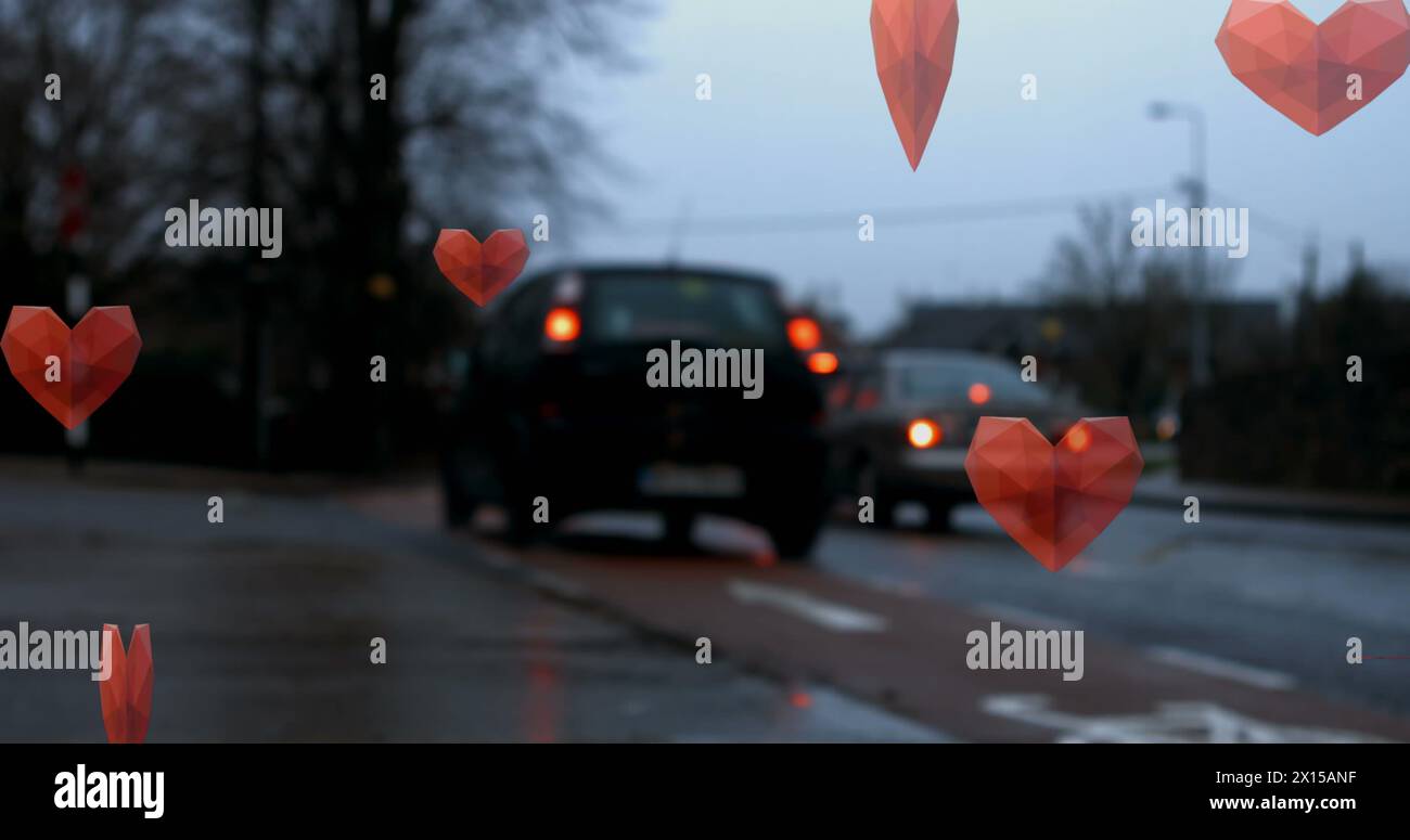Image of red hearts falling over road traffic Stock Photo - Alamy