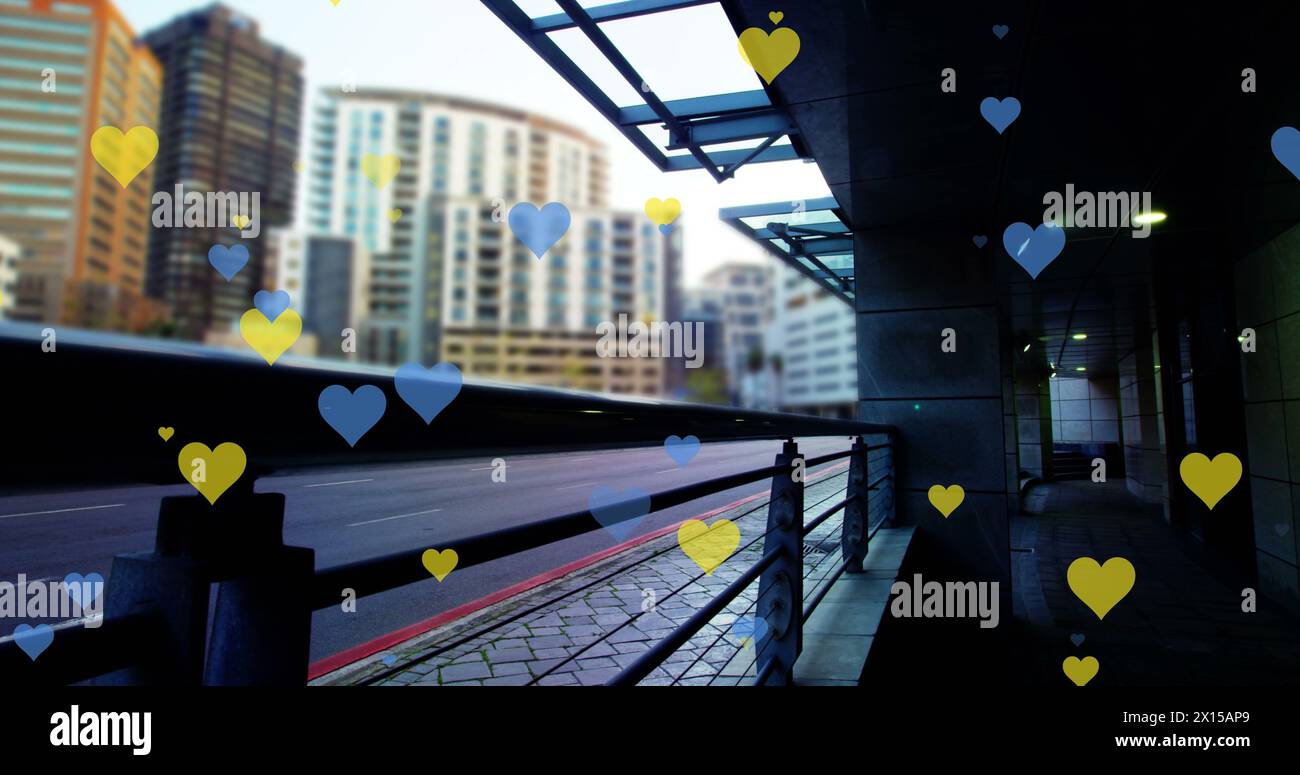 Image of yellow and blue hearts floating over cityscape Stock Photo - Alamy