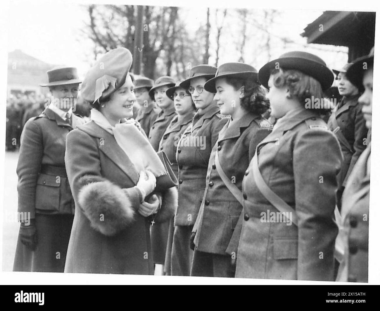 THE QUEEN INSPECTS A.T.S. - The Queen talking to NAAFI girls British Army Stock Photo