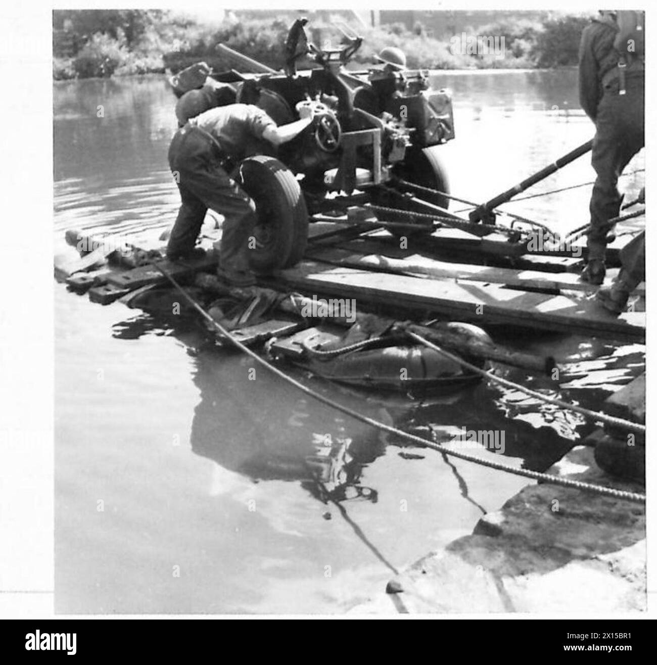Soldiers used improvised rafts to transport artillery across a river ...
