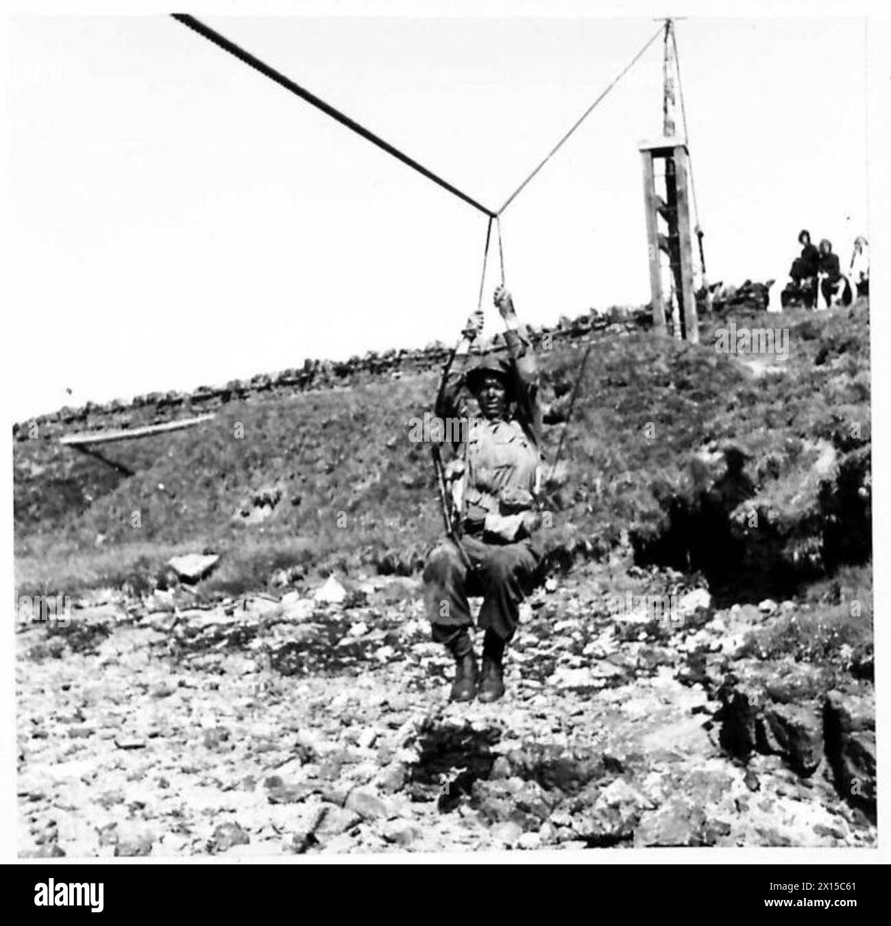 COMMANDER-IN-CHIEF HOME FORCES INSPECTS ORKNEY AND SHETLAND DEFENCES - The method of crossing a gully by rope was demonstrated British Army Stock Photo
