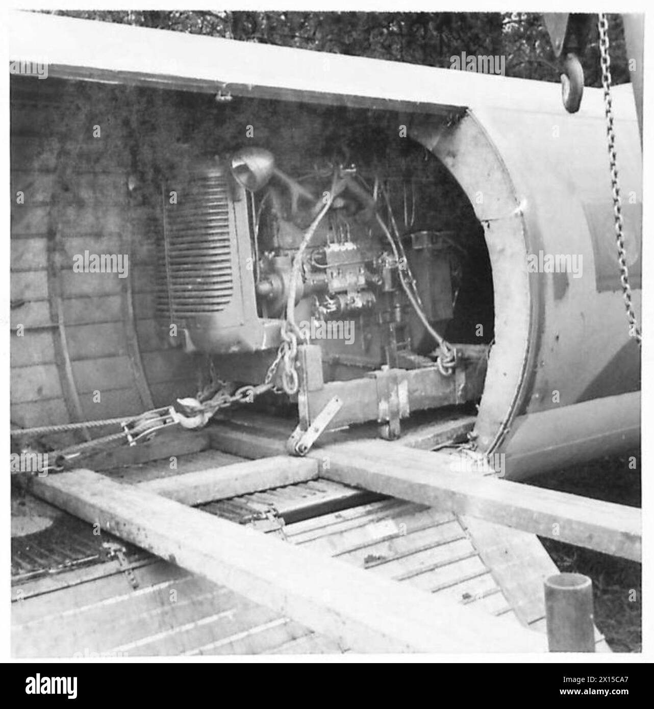AIRBORNE DIVISION LASHING EQUIPMENT - The loading and unloading of a D.40 tractor into a Horsa glider British Army Stock Photo