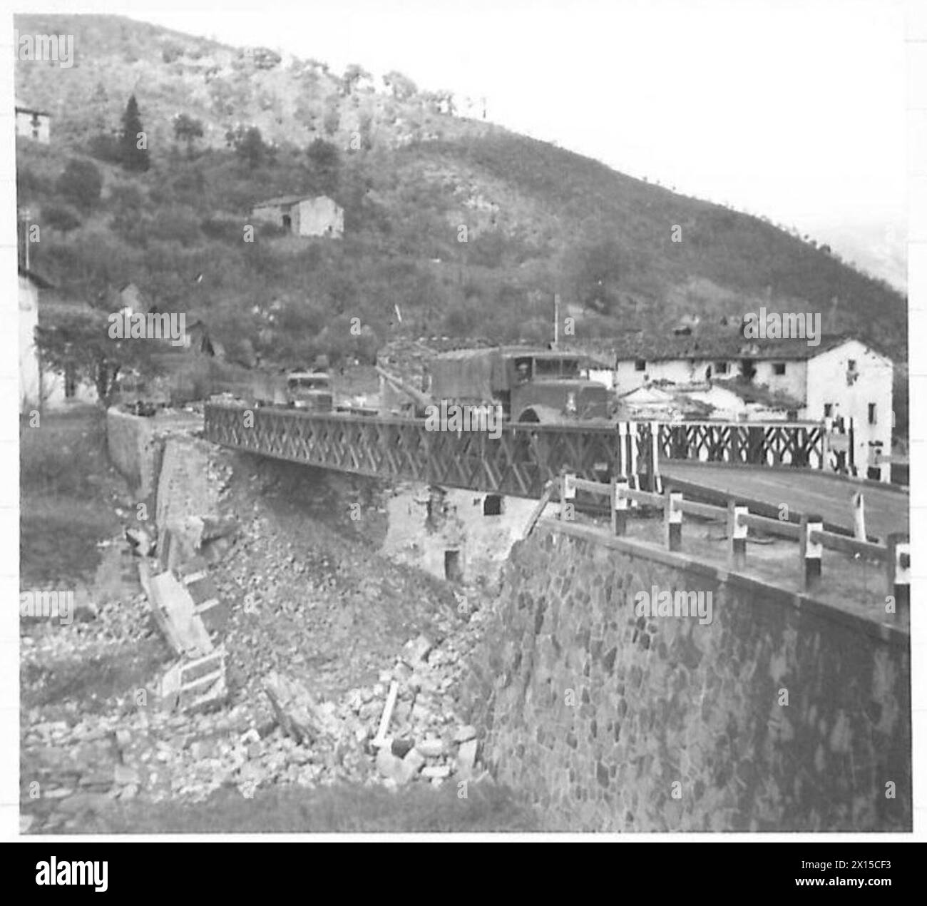 A Bailey bridge at Carbonile on Route 67 shows German demolition ...