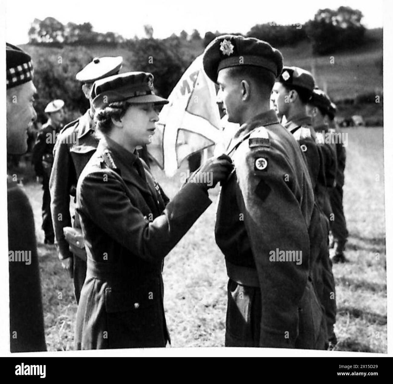 HRH the Princess Royal presents the DCM to Pte. J. Gallacher of the Royal Scots, who served in China and trained Chinese guerrillas, British Army. Stock Photo