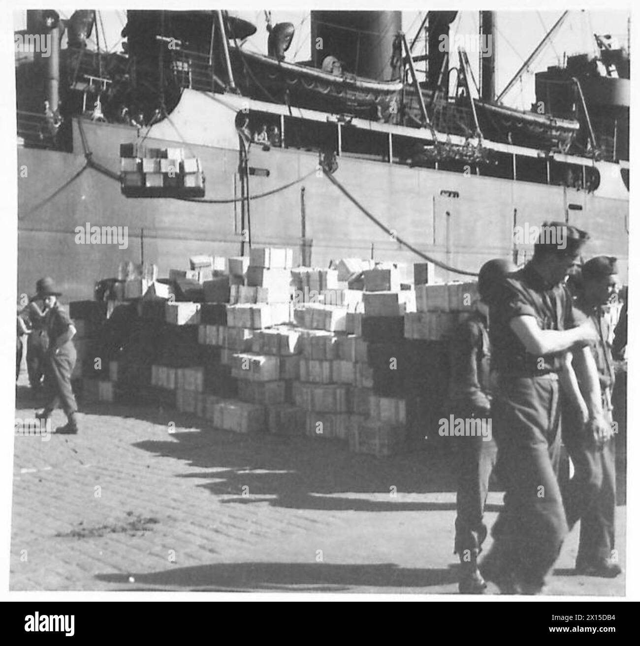 THE OPERATION TORCH, NOVEMBER 1942 Supplies being unloaded from an Allied transport ship on