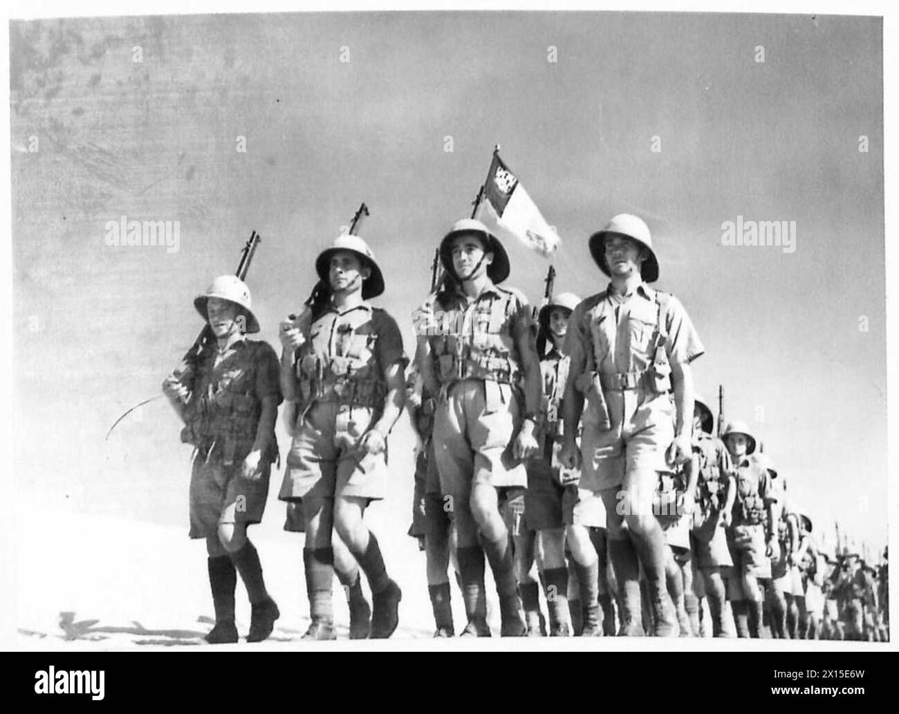 PHOTOGRAPHS TAKEN ON A VISIT TO A UNIT OF THE FREE FRENCH FORCES - An infantry unit on the march. Note Ensign British Army Stock Photo