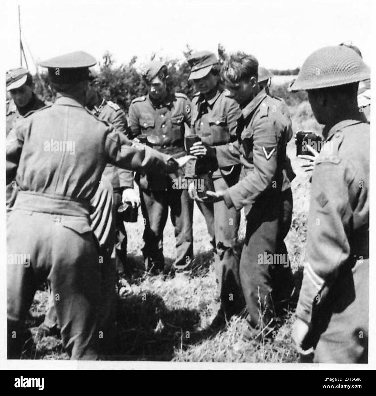 WW2 photo of German soldiers lined up for meal (POWs?) WW2 photo of German soldiers lined up for meal (POWs?)