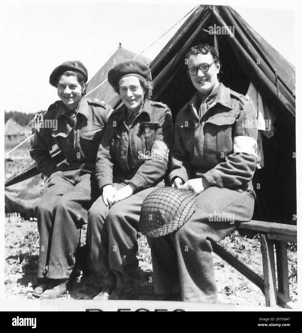 QAIMNS IN NORMANDY - Left to right:- Sister E.C.Hill of 27 Vicars Close, Wells, Somerset; Sister M. Mortimer, Victoria Road, Barnstaple, Devon, and Sister M.J.Bruines, Beckley House, Bledington, Oxford British Army, 21st Army Group Stock Photo
