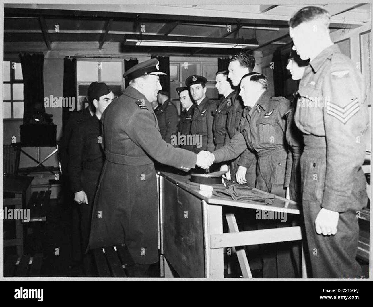 'ARIES' LEAVES FOR SOUTH AFRICA - [Pictures tie with AMB.Nos.20734 and 20737. Air Marshal Sir Arthur Coningham, Air Officer Commanding- in-Chief, Flying Training Command and the A.O.C. of No.25 Group Flying Training Command - Air Commodore C.N.H. Bilney, attended the briefing and were present when 'Aries' took off from Shawbury at 2.35 p.m. on 15th January 1946, for Thorney Island en route for South Africa. Air Commodore N.H. D�Aeth, CBE., commandant of the Empire Air Navigation School at Shawbury, flew as officer-in-charge of the mission. The captain of the 'Aries' is Wing Commander C. Dunnic Stock Photo