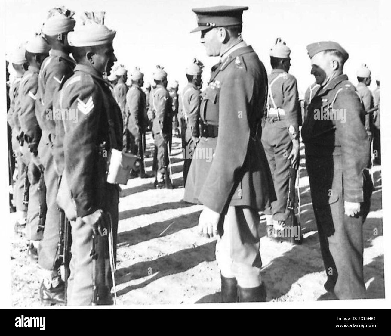 C-IN-C's TOUR OF 10TH ARMY - The C-in-C inspecting men of the 6th Div.H.Q British Army Stock Photo