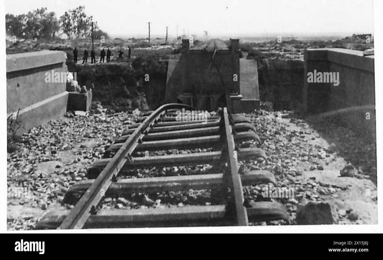 EIGHTH ARMY ADVANCE : SFAX-GABES AREA - The railway bridge over the Akarit Wadi, blown by the enemy in his hurried retreat British Army Stock Photo