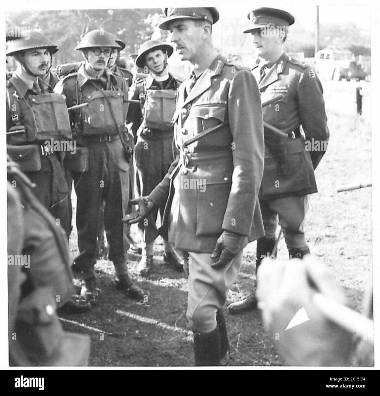 Lt. Gen. Schriber talks with departing officers during the transfer of infantry to the Royal Armoured Corps. Stock Photo