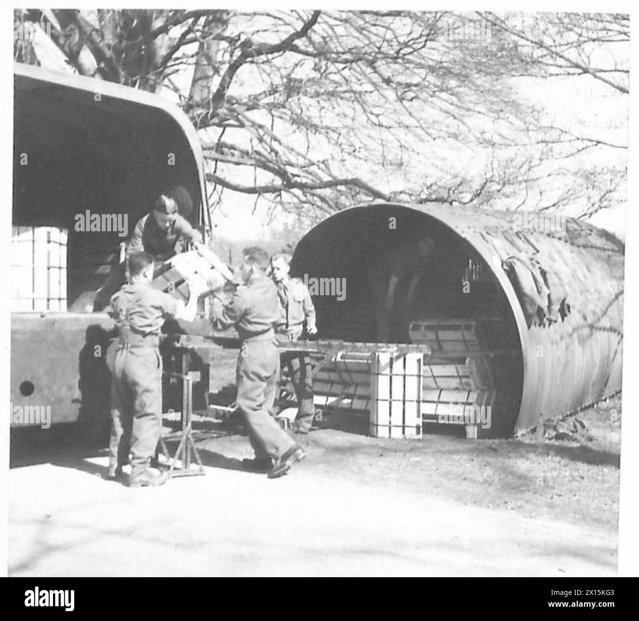 75 Shells 75mm artillery shells are stacked in preparation for deployment or use ...