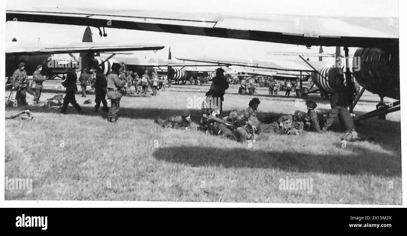 D-DAY - BRITISH FORCES DURING THE INVASION OF NORMANDY 6 JUNE 1944 - Troops of 6th Airlanding Brigade waiting beside their Horsa gliders at an RAF airfield before taking off for Normandy as part of 6th Airborne Division's second lift on the evening of 6 June 1944. Airborne troops admire the graffiti chalked on the side of their glider as they prepare to fly out as part of the second drop on Normandy on the night of 6th June 1944 British Army, 6th Airborne Division Stock Photo