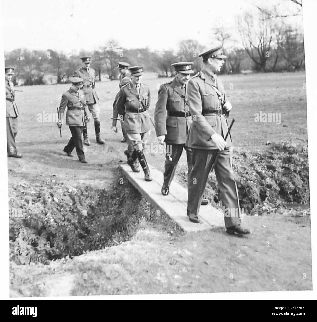 H.R.H. DUKE OF GLOUCESTER VISITS M.T. BATTALIONS IN NORTHERN COMMAND - HRH the Duke of Gloucester leaving the ranges, followed by Lt.Col. Sir Charles McGrigor, BT.,OBE., and Lt.Gen. T.R. Eastwood British Army Stock Photo