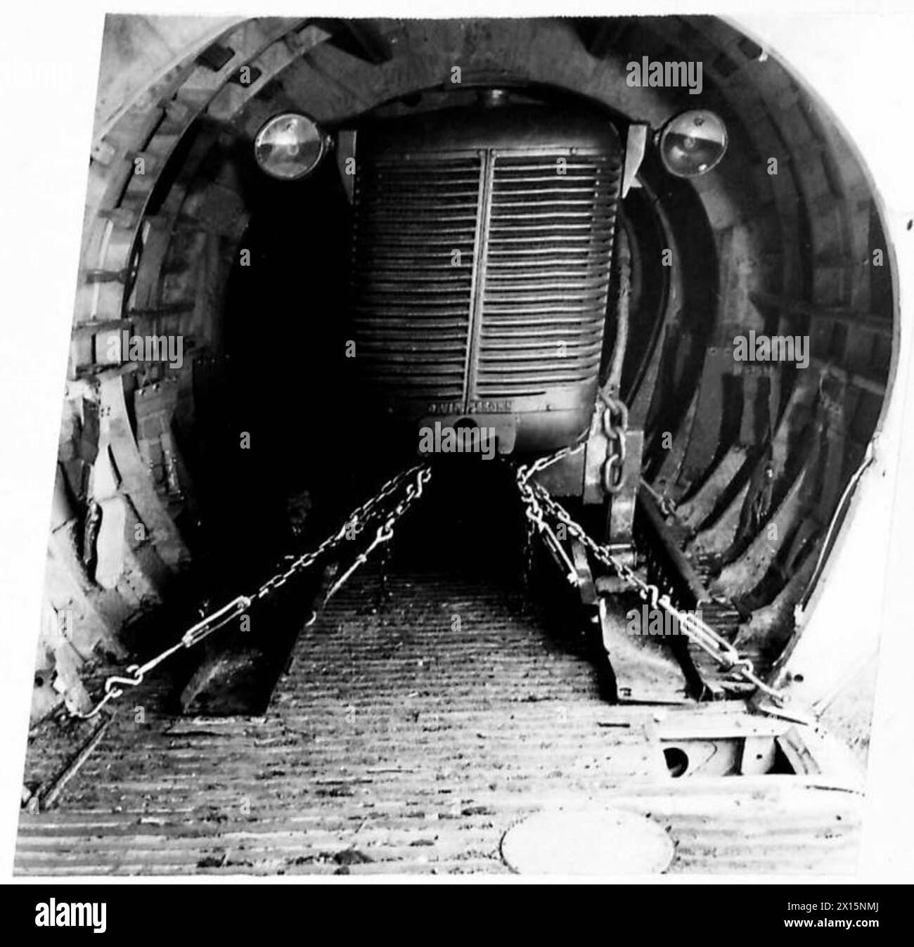 AIRBORNE DIVISION LASHING EQUIPMENT - The loading and unloading of a D.40 tractor into a Horsa glider British Army Stock Photo