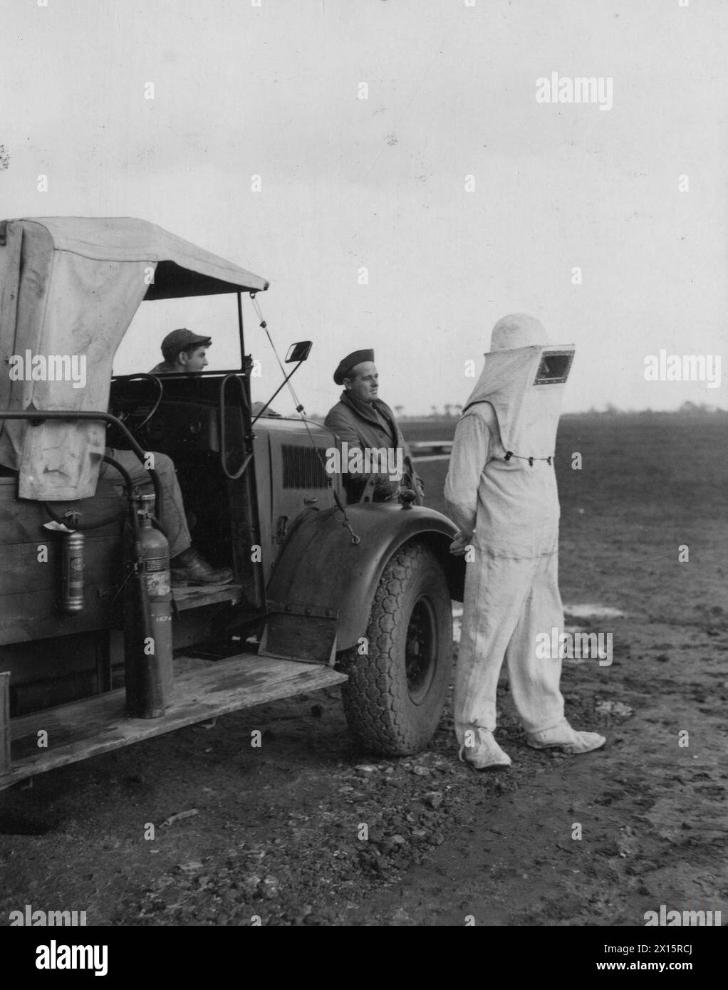 Pvt. Frank Kolin of the 353rd Fighter Group wears an asbestos suit for ...