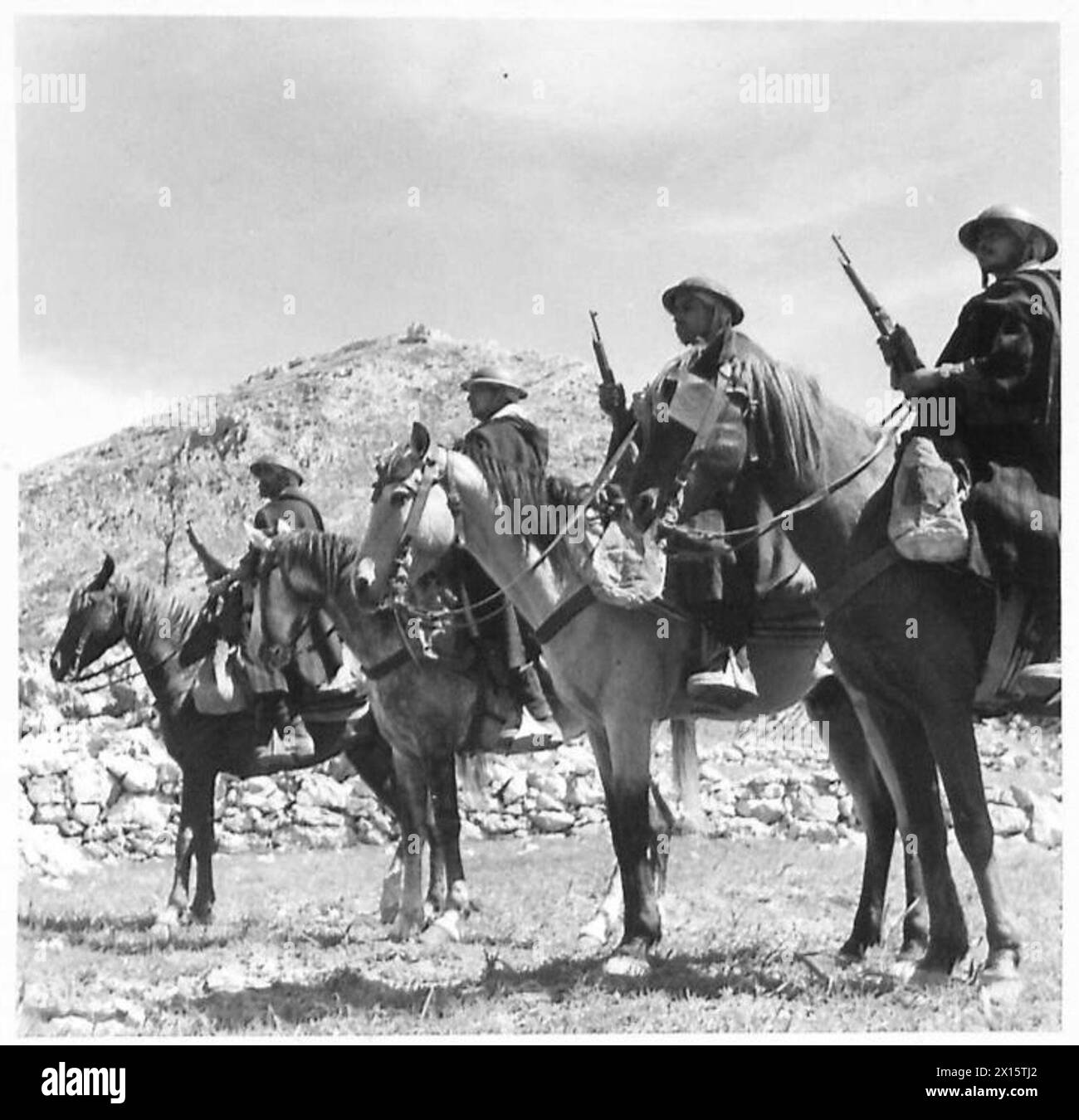 ITALY : FIFTH ARMY GOUMS HONOUR BRITISH DEAD - Goum horsemen, statue-like on their Arab steeds, during the One Minute Silence after the unveiling of the Tablet British Army Stock Photo