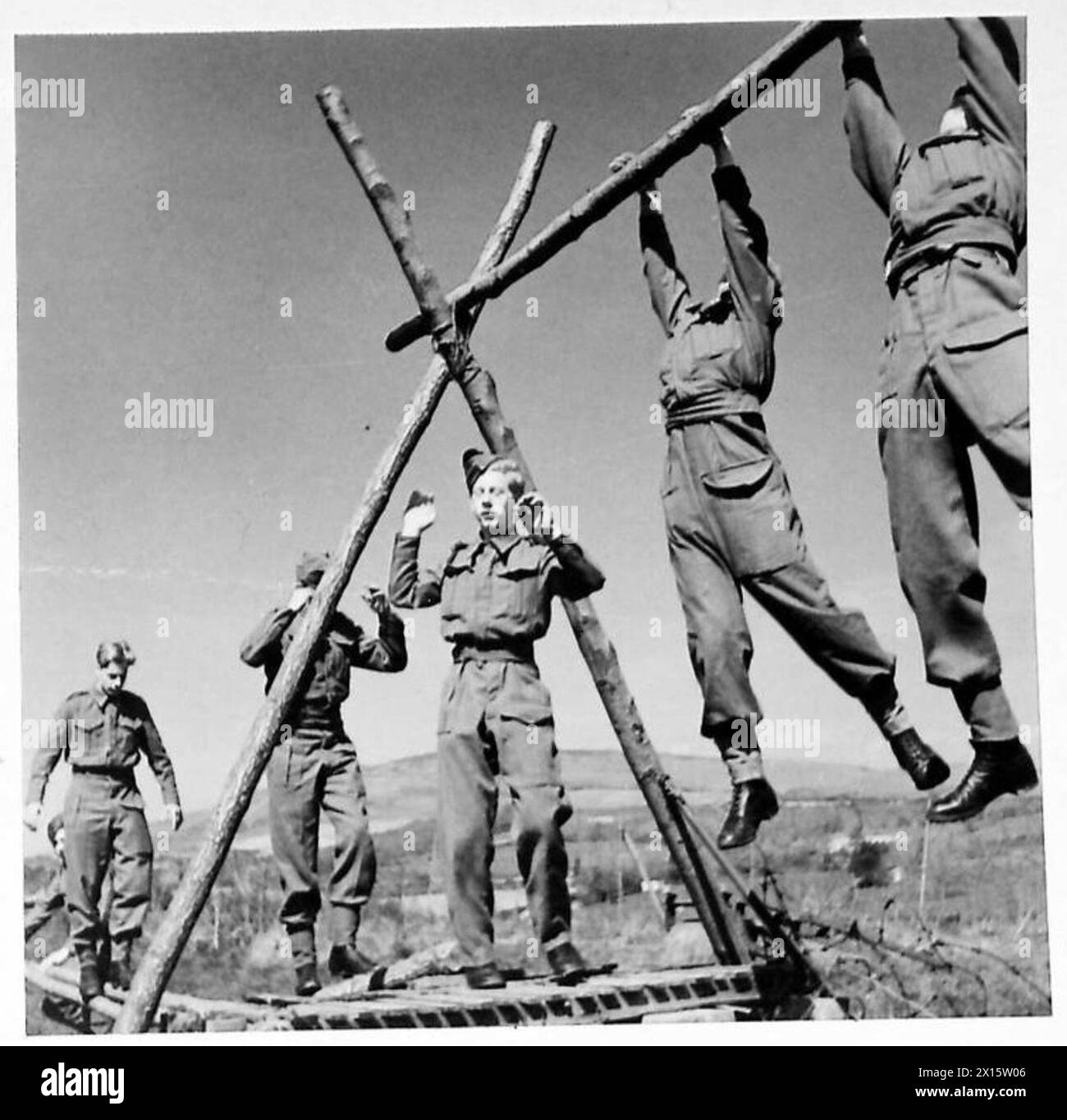 Pole Method Example Young soldiers in training cross a barbed wire entanglement using the ...