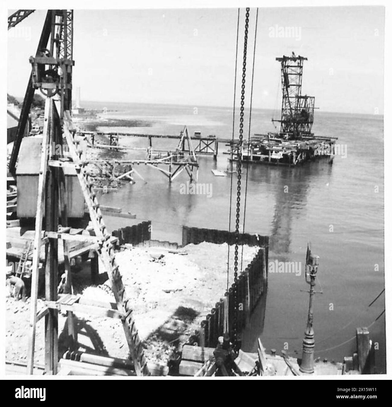 Construction progress at Larne Jetty includes sheet piling, filled ...