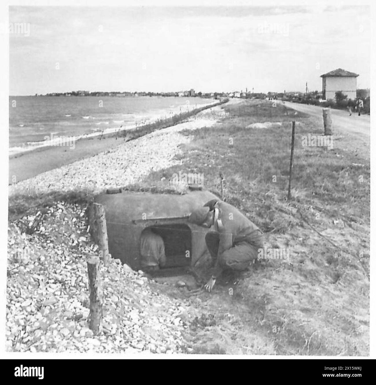 Enemy Machine An enemy machine gunner's view from a steel pillbox shows the beach ...
