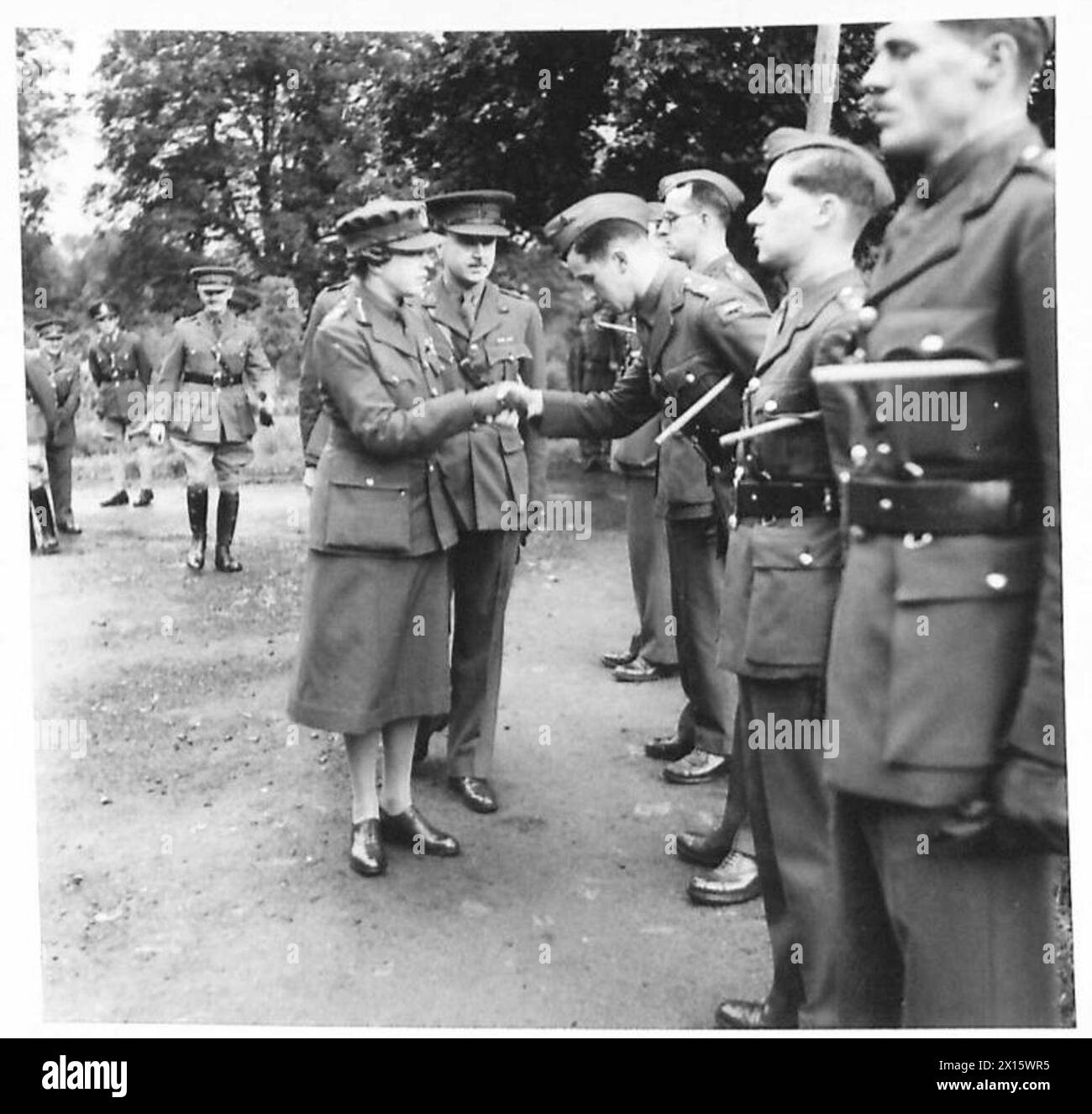 H.R.R. THE PRINCESS ROYAL VISITS NORTHERN IRELAND - H.R.H. is introduced to N.I.D. Signals officers by the Lt.Col. E.H. Cogan-Harris (Chief Signals Officer,NID) British Army Stock Photo