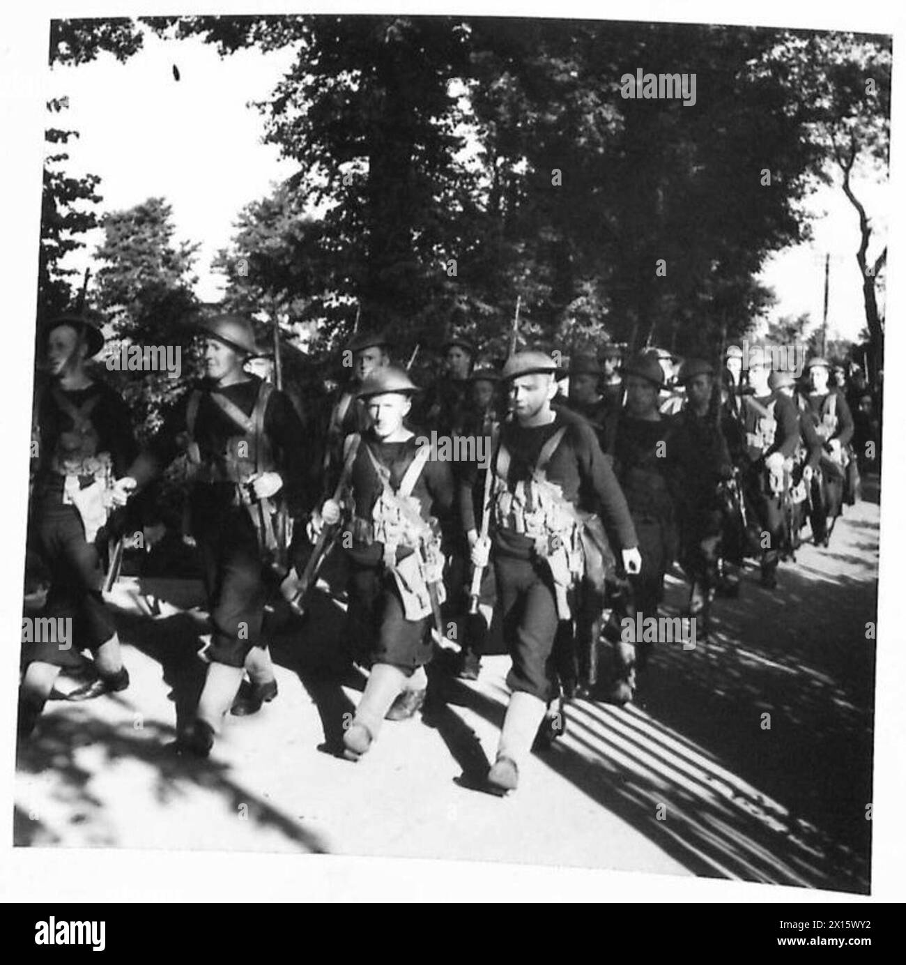 THE NAVY ASHORE Some of the sailors marching down a country lane