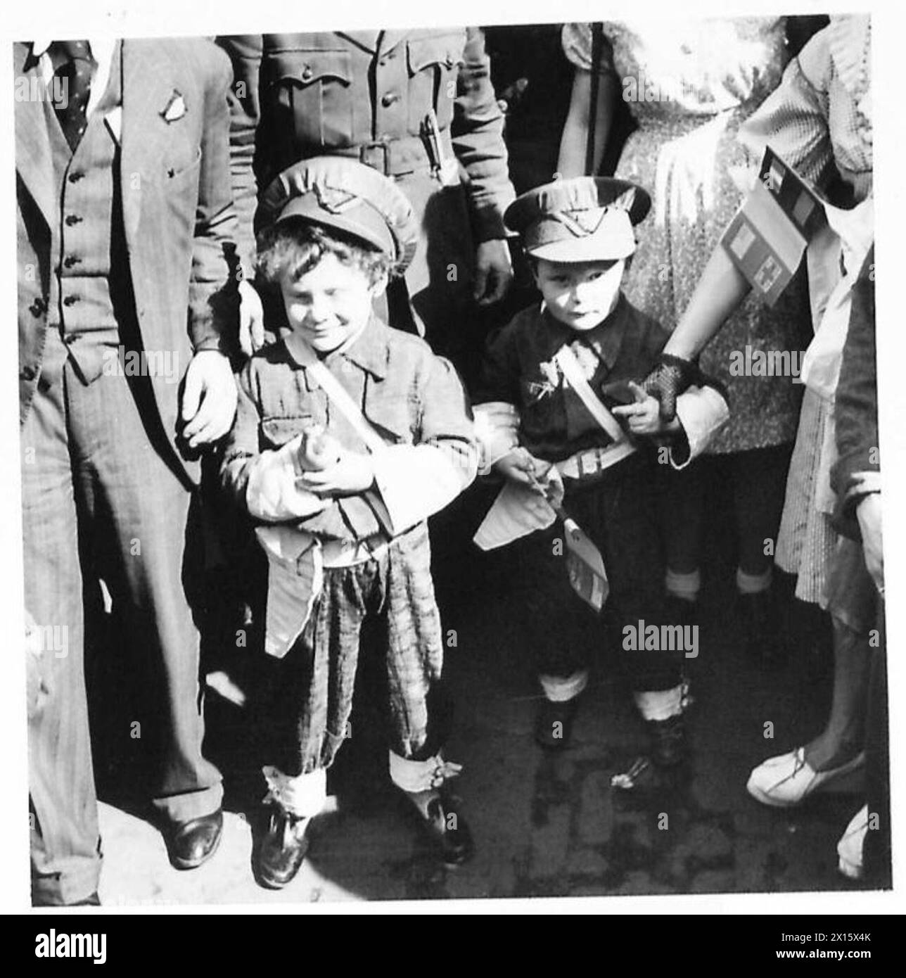 PEACE CELEBRATIONS IN BRUSSELS - Two little Belgian boys dressed as British soldiers British Army, 21st Army Group Stock Photo