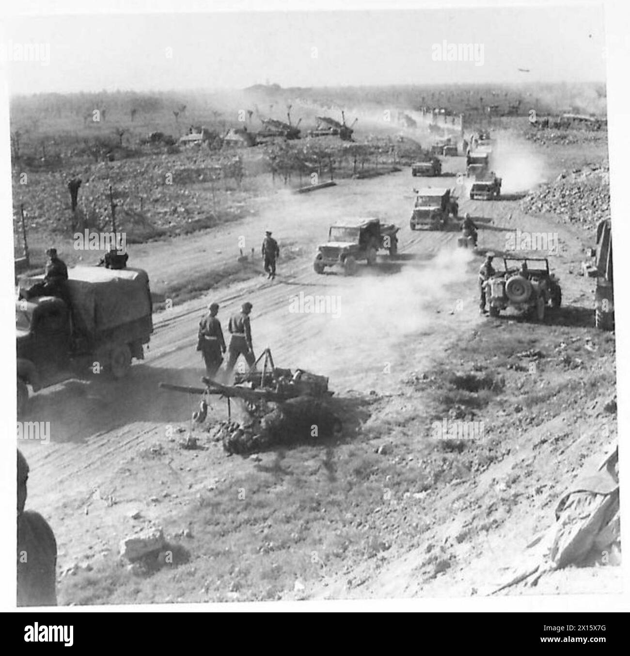 Supply vehicles of the Eighth Army cross the river Santerno in large numbers, highlighting logistics and transport operations during military campaigns. Stock Photo