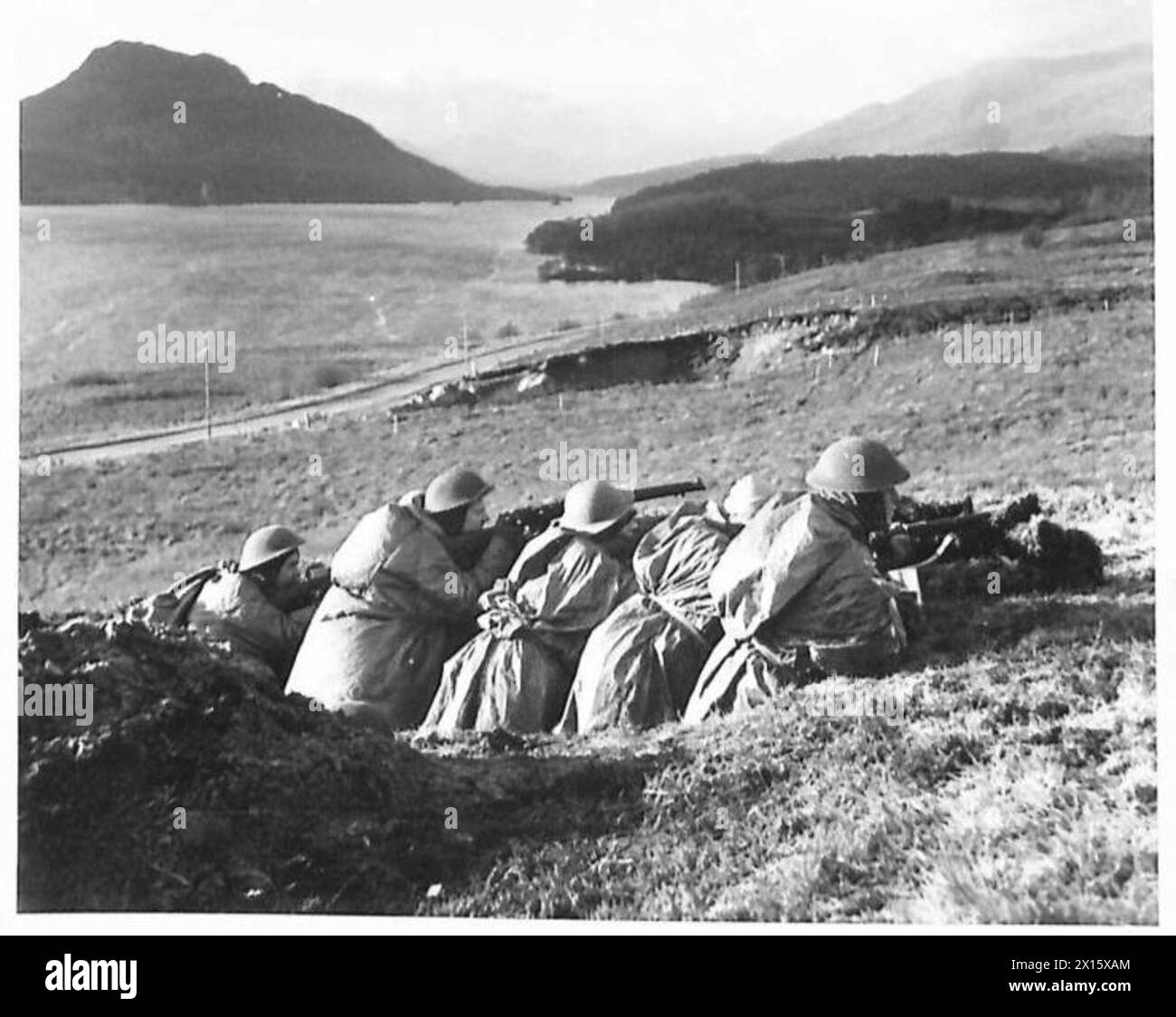 Royal Scots Fusiliers conduct firing exercises from a trench with a ...