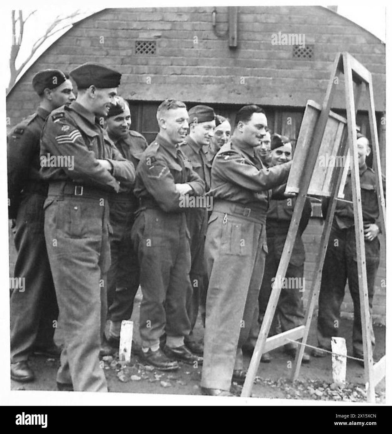 WAR CORRESPONDENTS VISIT AN AIRBORNE DIVISION - Glider crews emplane into one of the HORSA gliders British Army Stock Photo