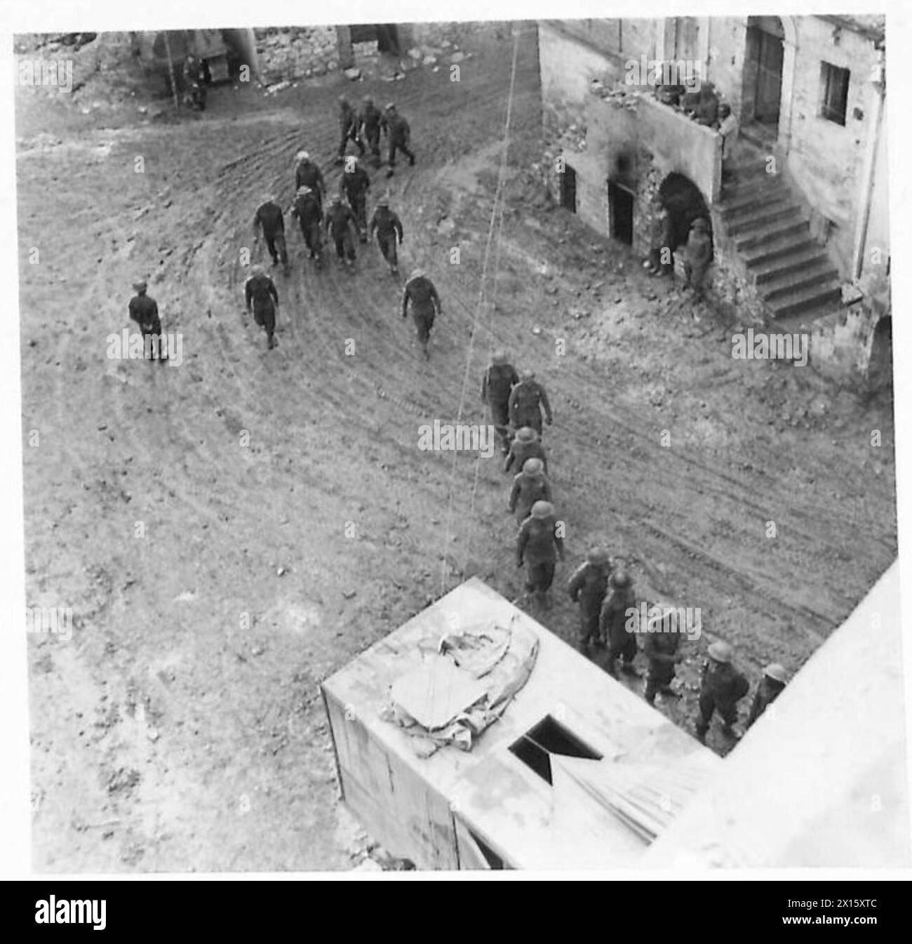 Indian troops line up for the morning cinema show while stationed with the Eighth Army. Stock Photo