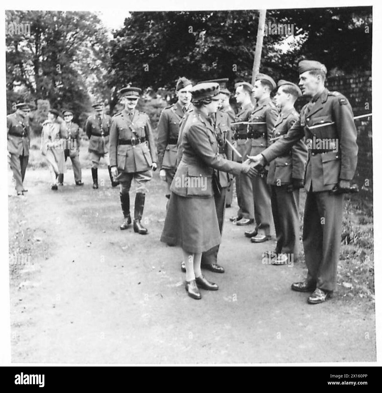 H.R.R. THE PRINCESS ROYAL VISITS NORTHERN IRELAND - H.R.H. is introduced to N.I.D. Signals officers by the Lt.Col. E.H. Cogan-Harris (Chief Signals Officer,NID) British Army Stock Photo