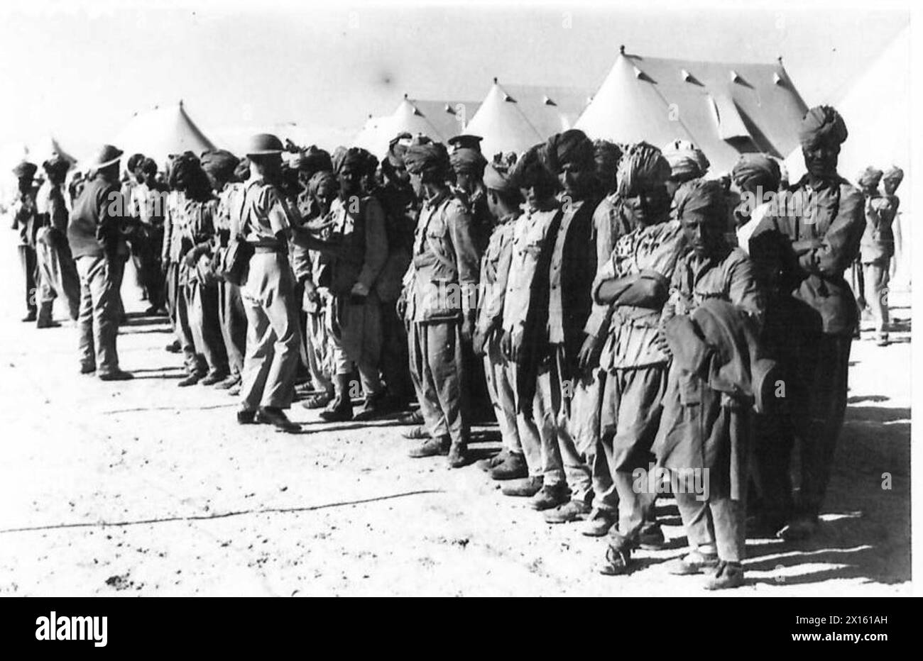 Italian prisoners of war are examined by British soldiers (Tommies ...