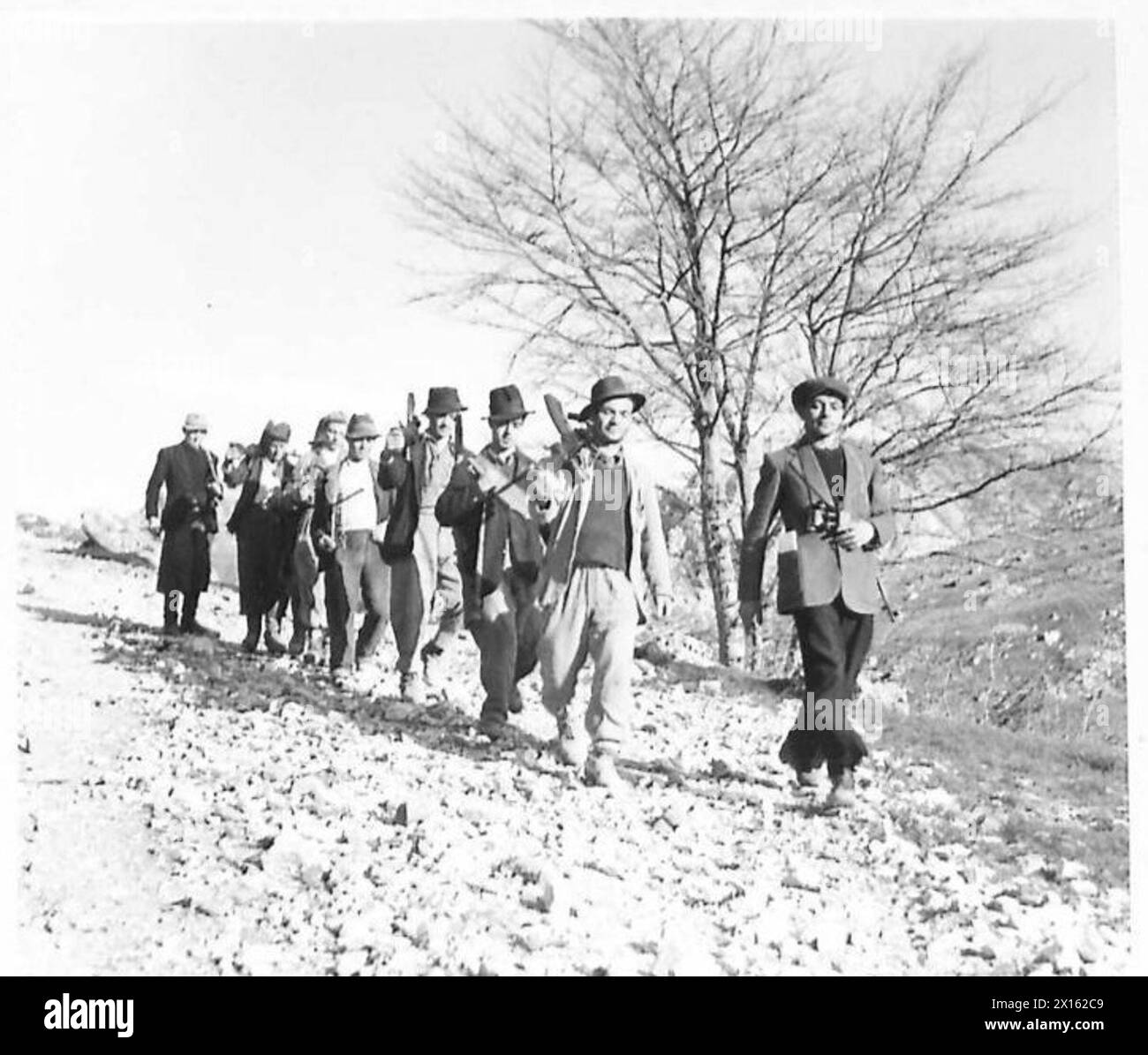 ITALY : ITALIAN GUERILLAS IN THE APPENINES - The small band set off with their chief to bring in information for the allies British Army Stock Photo
