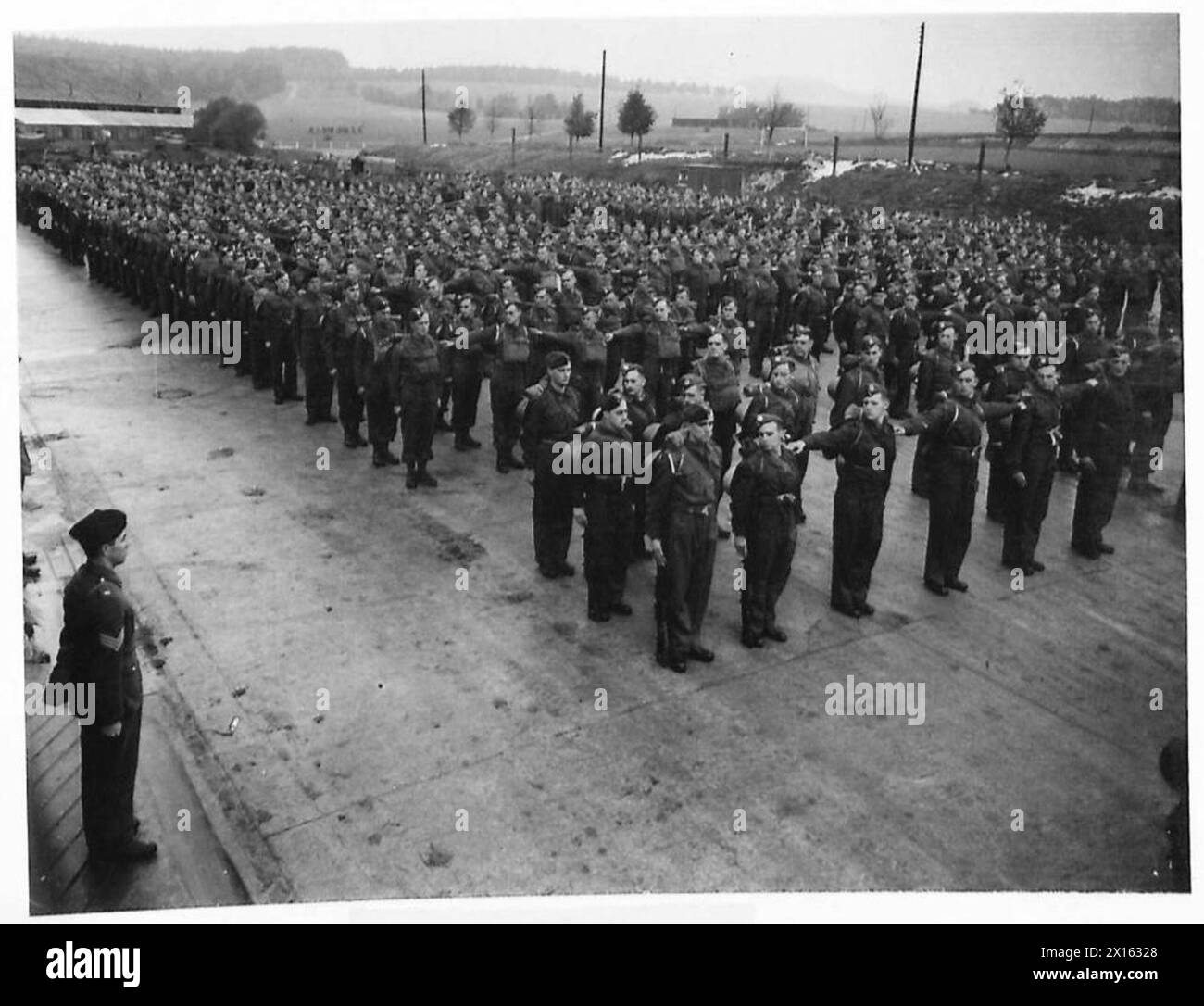 FROM 'CIVVIE' TO SOLDIER - Pte. Langley now shows signs of becoming a good soldier and is seen in the foreground on the parade ground British Army Stock Photo