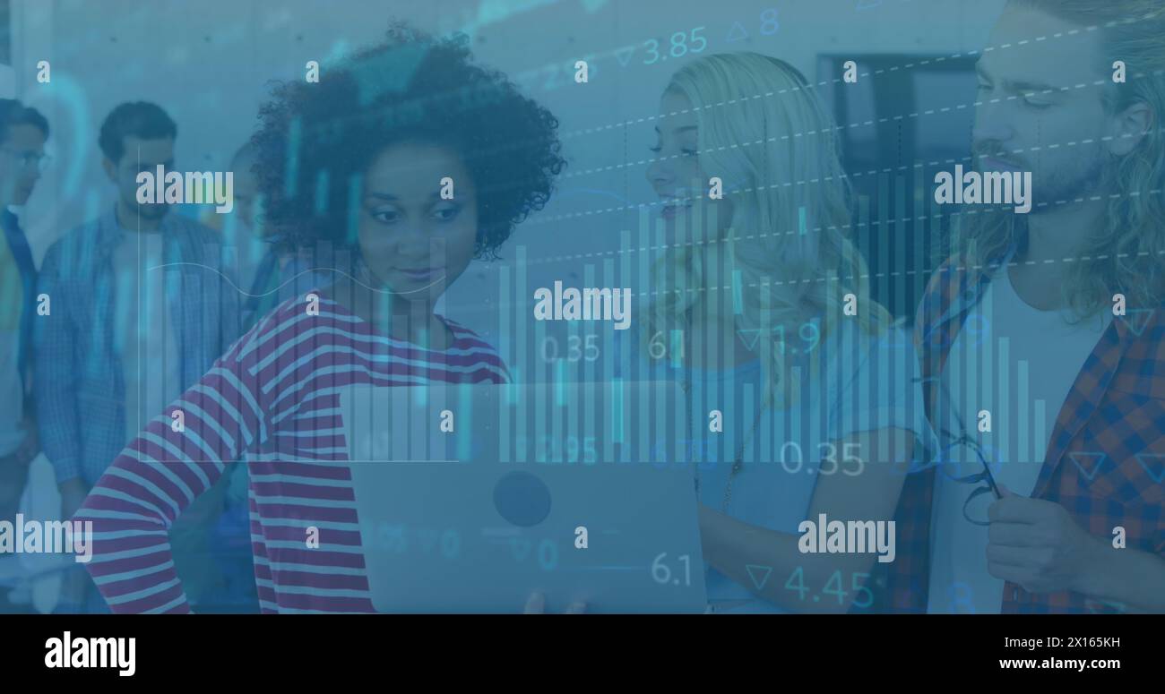 Image of statistical data processing over three diverse colleagues discussing over a laptop Stock Photo